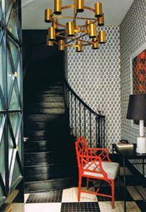 Red Chinoiserie lacquered chair in residential entry.