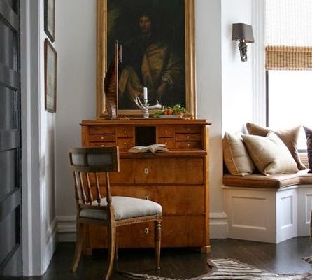 Living room in neutral color schemes accented by classic furnishings.