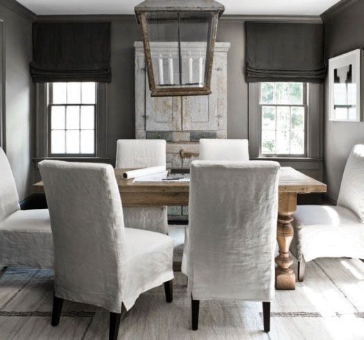 white slipcovered, armless dining room chairs