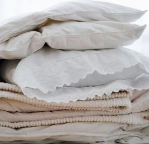 Soft pillows and linens in natural materials to signal taking care of Yourself During the Thanksgiving Holiday