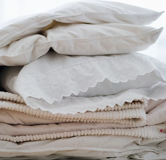 Soft pillows and linens in natural materials