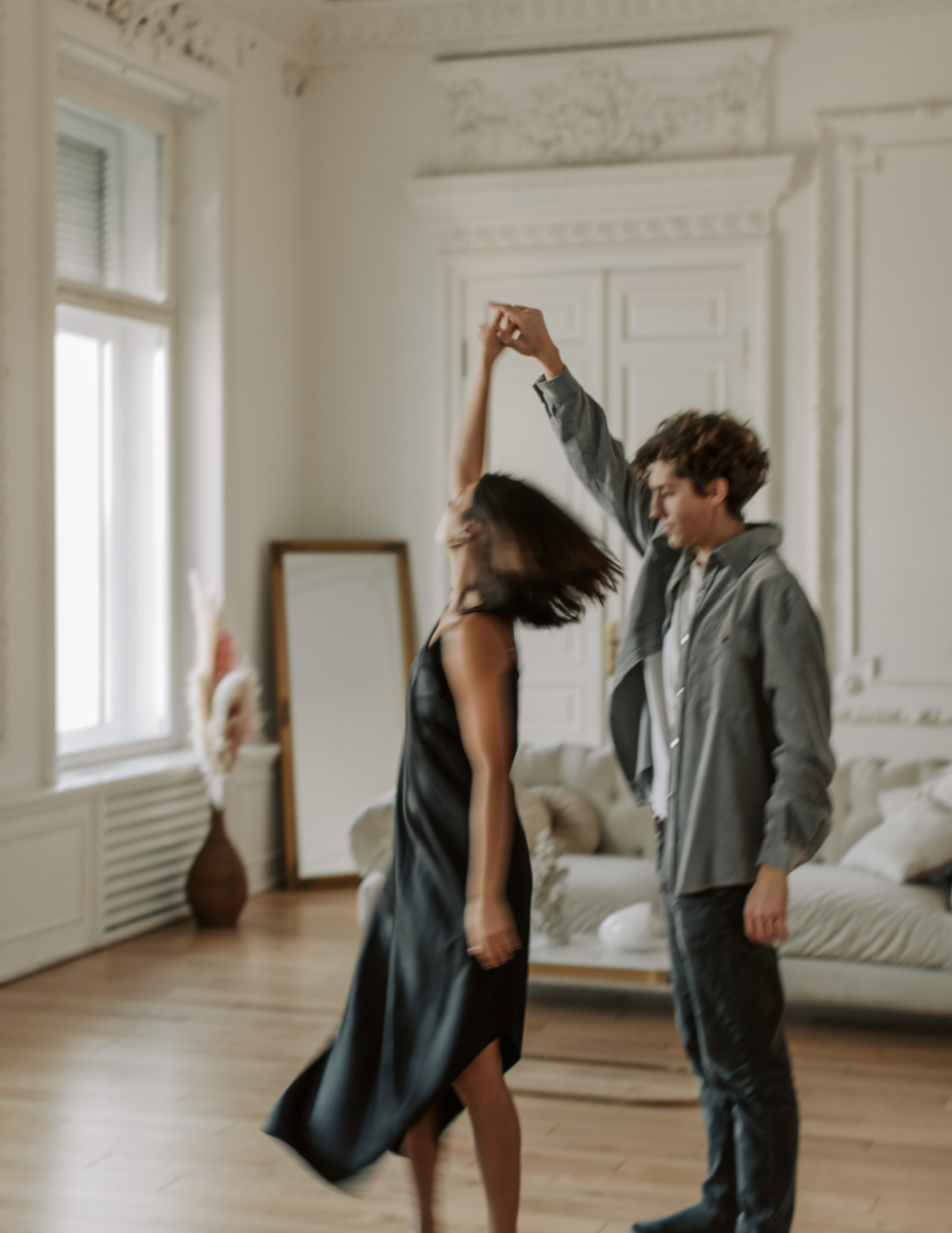 Couple at home, dancing in living room