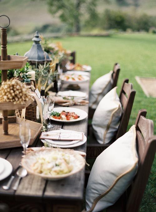 Outdoor tablesetting with fall decorations.
