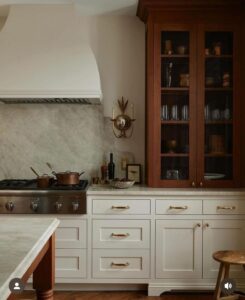 Kitchen with white base cabinets and stained wood upper cabinets