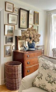 antique dresser with basket and art
