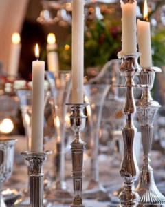 Silver candlestick collection with ivory tapers are great accessories for a well stocked home