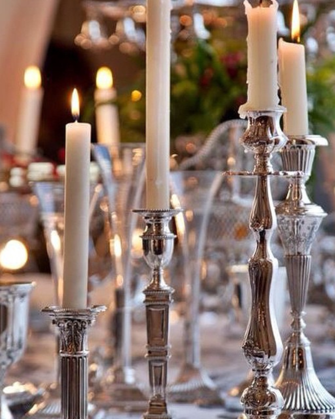 Silver candlestick collection with ivory tapers